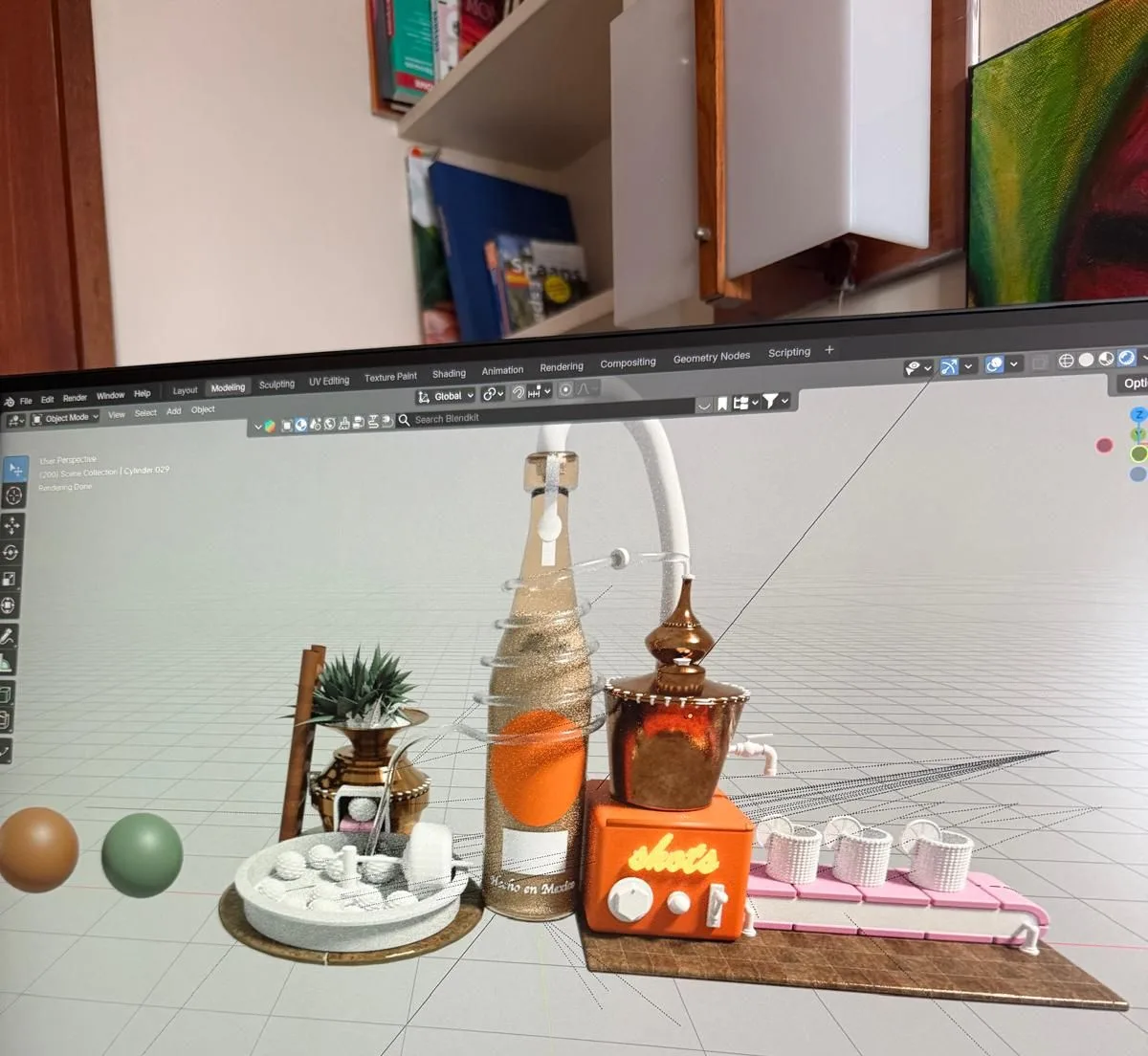 First texture iteration in Blender: a gold-flecked bottle, a copper still, an orange shots machine and white shot glasses on a plain grey background